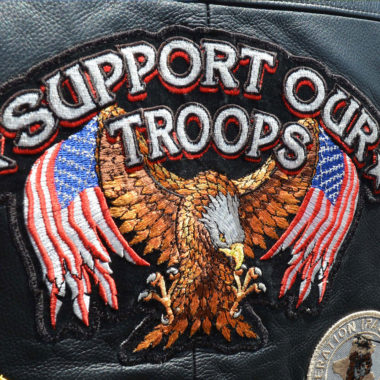 Biker with Support out Troops leather vest.