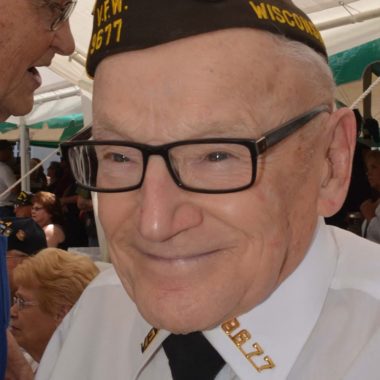 A smiling Veteran representing the local VFW.